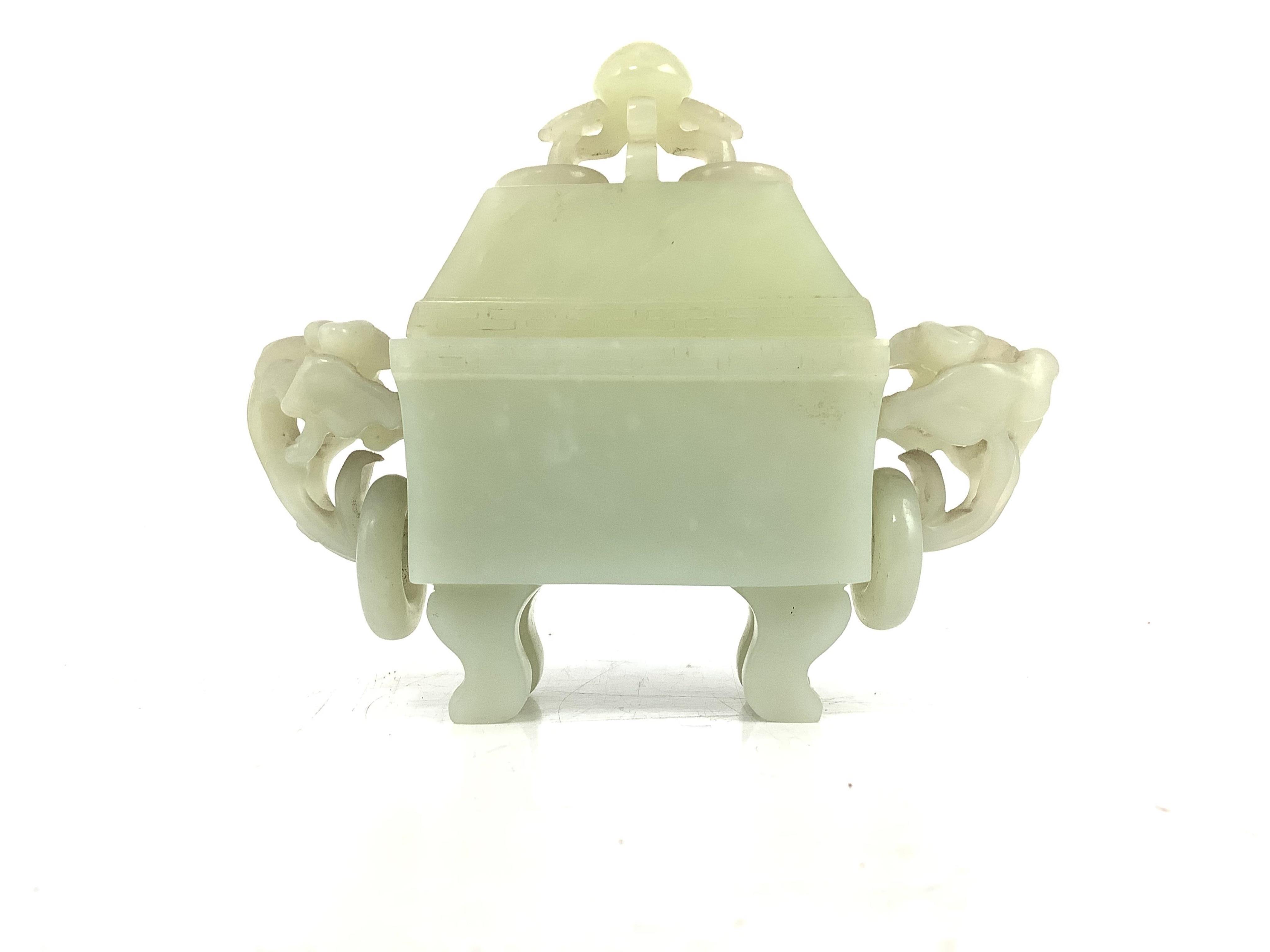 A Chinese pale celadon jade rectangular vase and cover, 19th/20th century